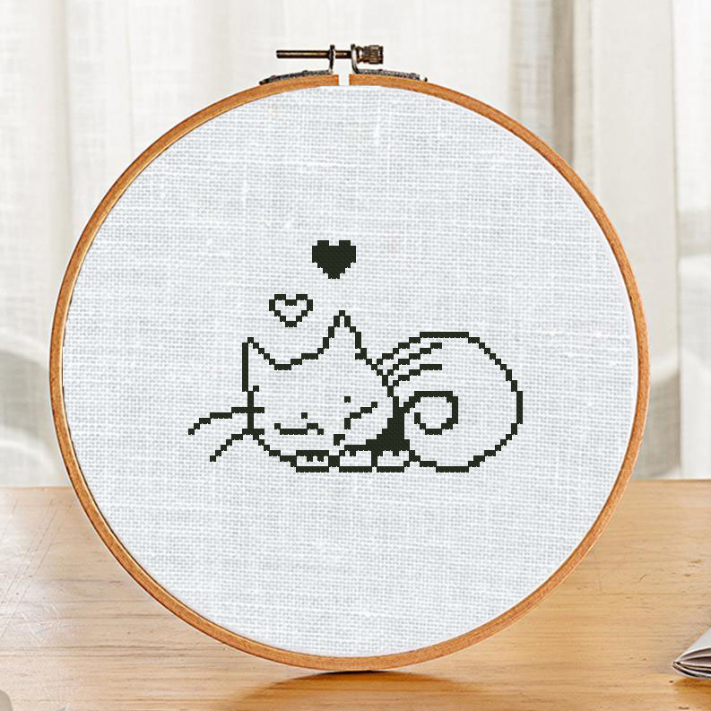 The free printable monochrome cross-stitch pattern "Sleeping Cat" in modern style. It can be used for gift or cloth decor. It is suitable for hoop art. Just add any sign and you'll get a personalized gift.