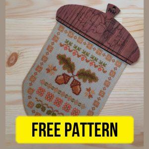 Free cross stitch pattern with primitive acorn designed by Ruzanna Gladkova.