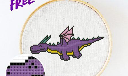 Free cross stitch pattern with a happy dragon designed by Julia Strekalova.