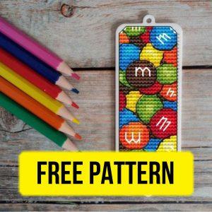 Free cross stitch pattern with MM candies in pencil bookmark design designed by Anna Alexandrova.
