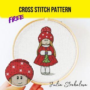 Free cross stitch pattern with a New Year doll designed by Julia Strekalova.