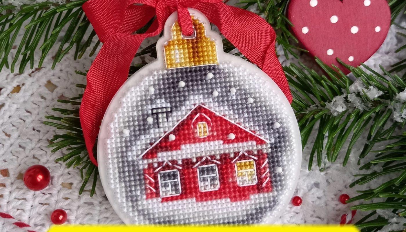 Free cross stitch pattern with a Christmas house designed by Toma Reznichenko.