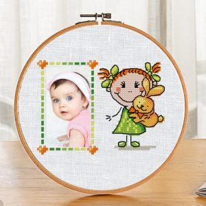 The free cross-stitch pdf printable pattern "Girl Frame" in modern style.